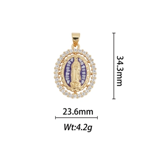 Detailed view of 18k gold plated Virgin Mary pendant with blue enamel and cubic zirconia
