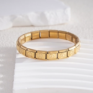Bracciale modulare in acciaio inossidabile dorato con segni di pace incisi su supporto