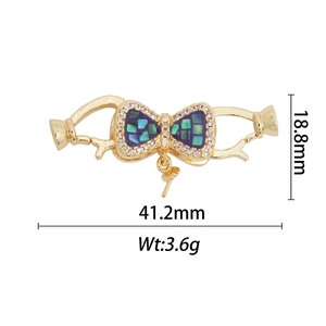 Vue détaillée du pendentif nœud plaqué or 18k avec dimensions de 41,2 mm et poids