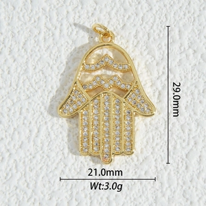 Detailed view of 18K gold plated Hamsa Hand pendant with zircon stones, 29mm x 21mm