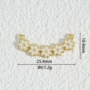 Macro detail of enamel flower jewelry connector with 25.4mm length and 10.4mm width dimensions