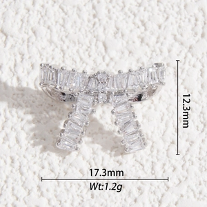 Detailed bow crystal pendant with measurements: 12.3mm height, 17.3mm width and 1.2g weight