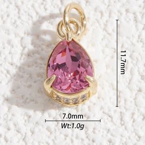Detail view of faceted pink crystal teardrop pendant with gold metal and zircon trim
