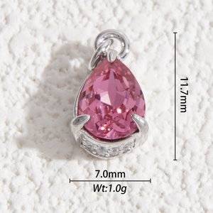 Macro shot of pink pear-cut crystal pendant with tiny side stones, size 11.7x7.0mm