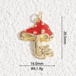 Macro shot of red mushroom charm with golden dots and measurements 20.5x16mm