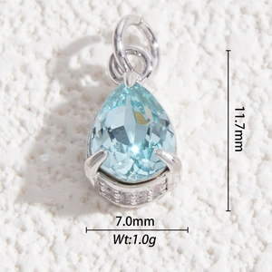 Macro shot of 11.7mm pear-shaped light blue crystal pendant with silver setting