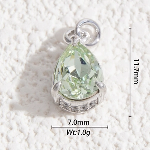 Close-up of light green teardrop crystal pendant with silver setting and dimensions