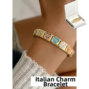 Detailed view of Italian charm bracelet with golden links and colorful enamel hearts