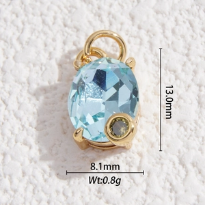 Detailed view of sky blue oval gem with olive green stone in gold setting, 13mm size