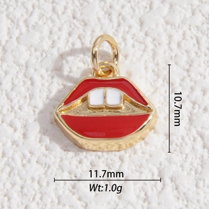 Macro shot of a red lip-shaped pendant charm with gold metal edges and dimensions