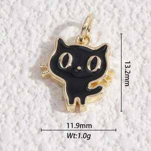 Detail of a black enamel cartoon cat pendant with gold metal frame and size markings