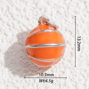 Detailed macro view of orange enamel basketball pendant with size and weight dimensions