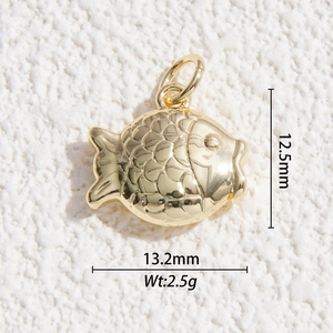 Detailed macro view of a gold-plated fish pendant with engraved scales and 13mm dimensions