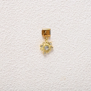 Golden flower charm for Italian modular bracelets with white rhinestones and a central stone