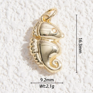 Macro detail of gold-plated seahorse pendant showing 16.3mm height and 9.2mm width