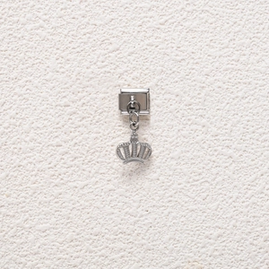 Detail of silver crown charm on Italian modular stainless steel bracelet link