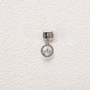Detailed close-up of Italian stainless steel charm with rhinestone crown pendant