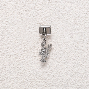 Detailed close-up of a silver lobster charm on an Italian stainless steel modular link