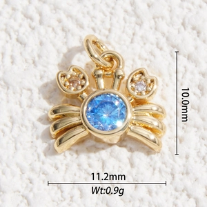 Gold plated crab necklace pendant with blue gemstone and white zircon detail
