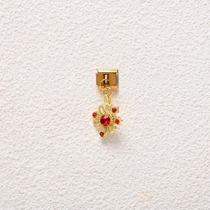 Detail of gold floral modular charm with red rhinestones for Italian link bracelets
