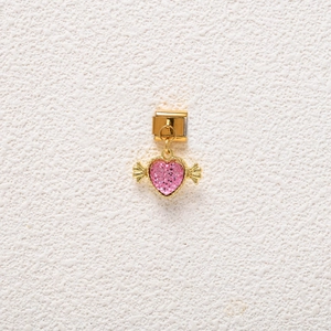 Detailed view of pink glitter heart charm with gold wings for Italian modular bracelets