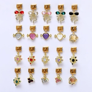 Detailed grid of 20 assorted gold charm modules with colorful rhinestones and crystals