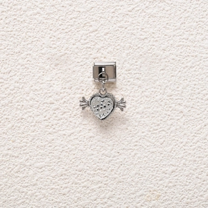 Macro view of winged heart charm link with crystal pavé for modular Italian bracelets