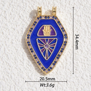 Pendentif bouclier Main de Hamsa en émail bleu avec cristaux et finition dorée