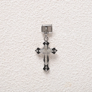 Detail of Italian charm with black enamel gothic cross and sparkling white rhinestones