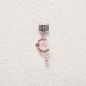 Close-up of pink crystal crescent moon and butterfly charm for Italian modular bracelet