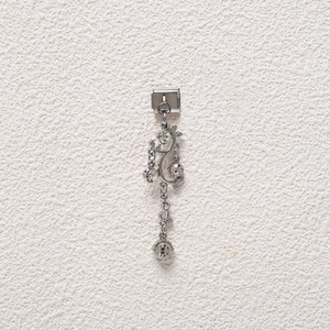 Detail of silver Italian charm with dangling vine design and clear crystals on steel base
