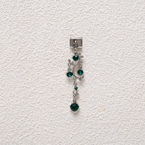Detailed close-up of a silver vine modular charm with emerald green crystals for DIY jewelry