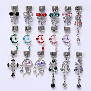 Detailed close-up of diverse Italian charms with colorful crystals and steel base