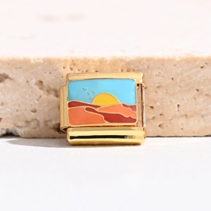 Detail of 9mm Italian charm link with colorful enamel sunset scenery on golden steel