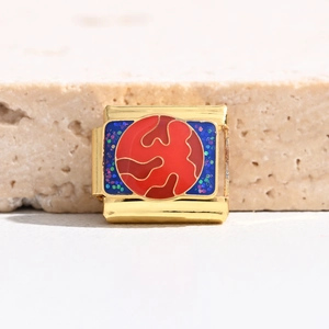 Detailed view of Italian charm link featuring red camouflage enamel and blue glitter