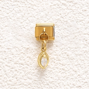 Detailed view of Italian charm link with marquise-cut crystal pendant in gold finish
