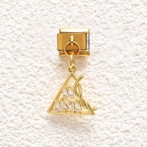 Close-up of golden Italian charm link with baguette-cut zircon triangle pendant