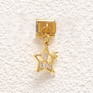 Detailed close-up of a gold Italian charm link with a sparkling star-shaped pendant