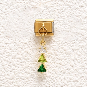 Detail of Italian modular charm link with three triangular green gradient crystals
