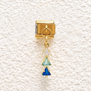 Detailed view of Italian charm link with gradient blue triangle crystals in gold finish