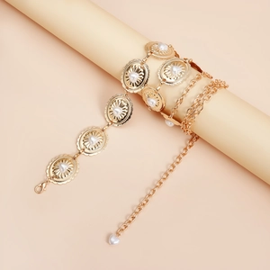 Close-up of golden sunflower oval links with heart pearl inlays on a waist chain