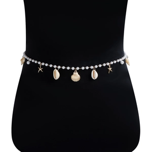 Detail of summer beach pearl waist chain with golden starfish and seashell charms on mannequin
