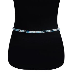 Close-up of double-layer beaded waist chain with blue and white pearls on body form