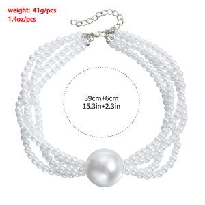 Detail view of multi-layer pearl choker with oversized center bead and silver clasp