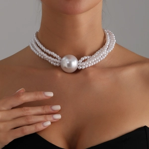 Three-layer faux pearl choker necklace featuring a large central oversized pearl bead