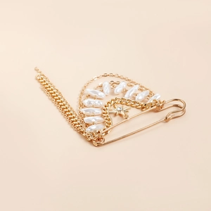 Vintage gold brooch with layered chains, white pearls and sparkling star pendant