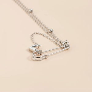 Silver bead chain necklace with minimalist safety pin and polished heart pendant