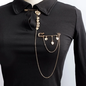 Vintage gold heart chain brooch with multi-layer tassels on black long-sleeve polo shirt