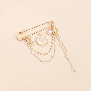 Broche océan dorée avec étoile de mer, coquillage, perles et longues chaînes à franges