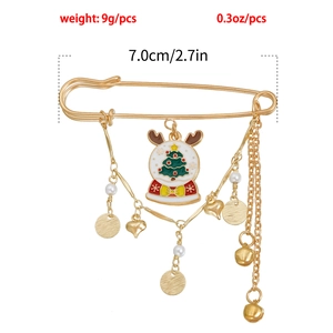 Detail of Christmas brooch showing dimensions of 7cm length with holiday charms